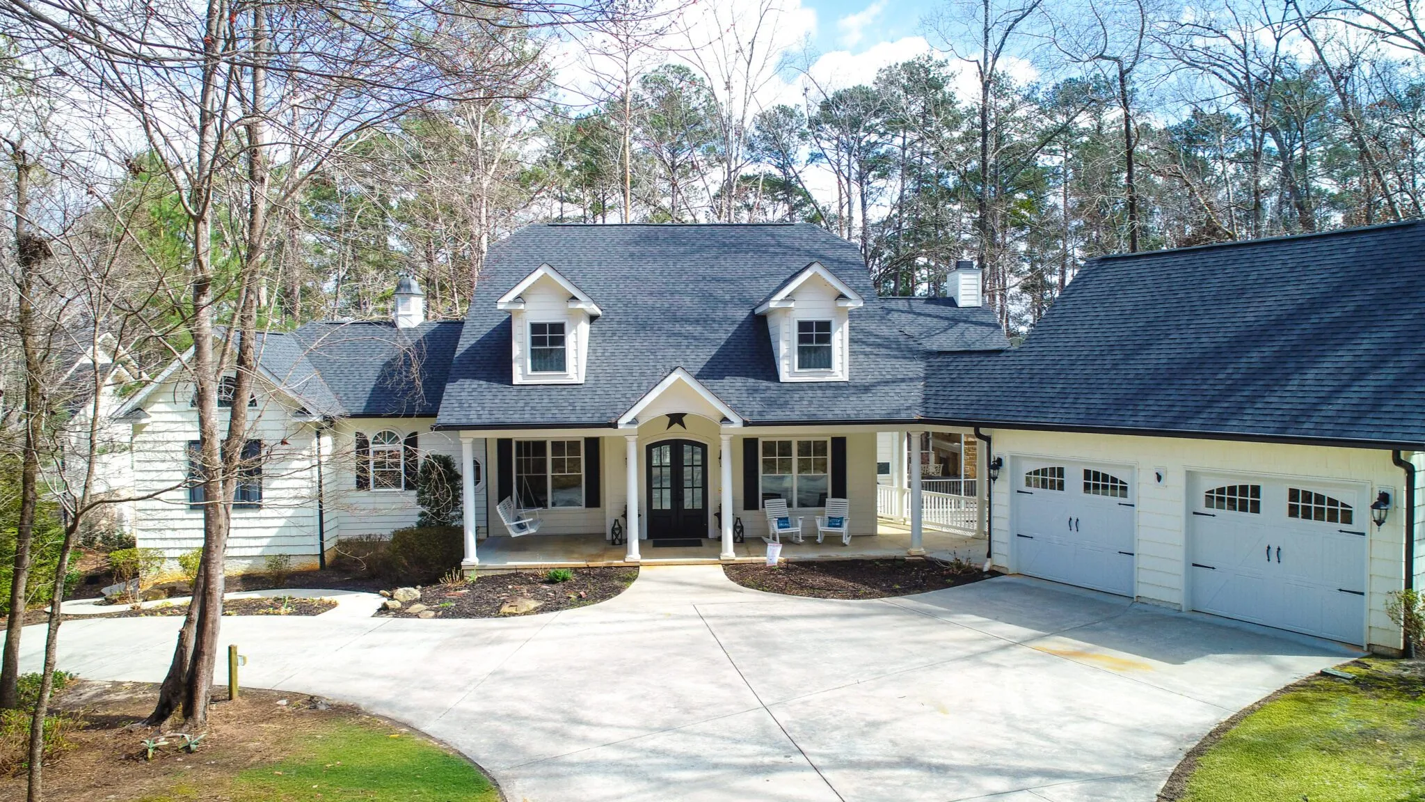 Resale home on Bereau Drive in Savannah Lakes Village with dormers, a covered front porch and a two-car garage