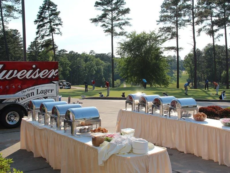 Actual photograph of an outdoor buffet set up at a Savannah Lakes Village club event