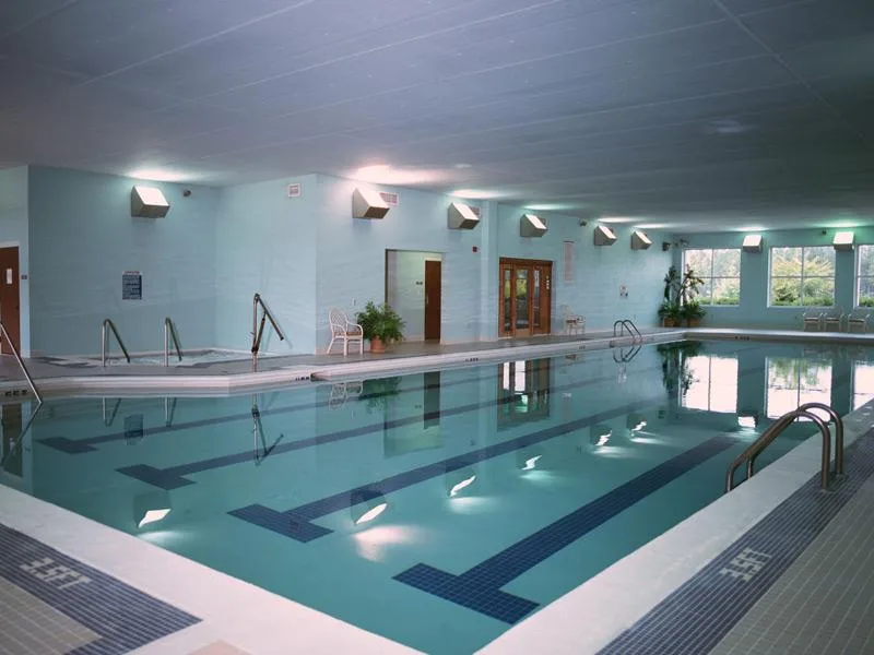 Actual photograph of the heated indoor lap pool with lane lines
